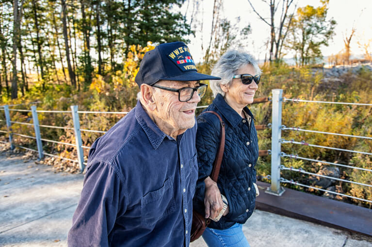 New York Veteran walking in park.